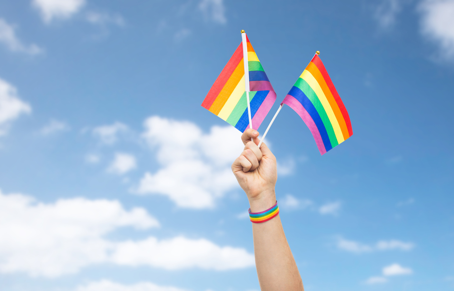 Hand Holding Pride Rainbow Flags